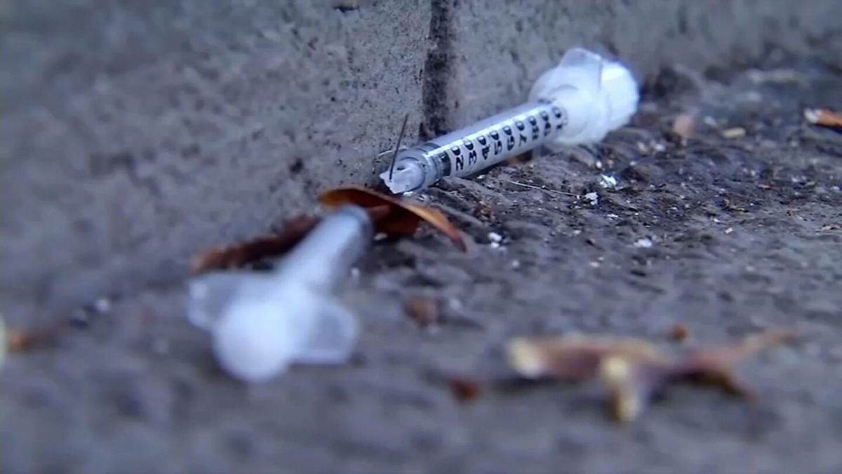 <i>KGO</i><br/>A broken syringe needle is seen on a sidewalk in the Tenderloin District of San Francisco. Opioid deaths have jumped this year.