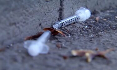 A broken syringe needle is seen on a sidewalk in the Tenderloin District of San Francisco. Opioid deaths have jumped this year.