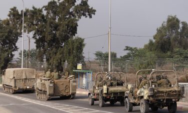 Israeli tanks and troops move near the border with Gaza on October 28