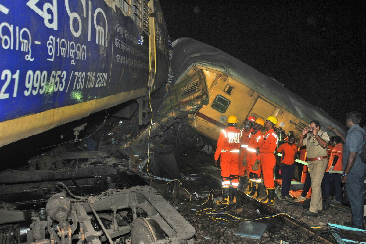 <i>AP</i><br/>Rescuers at the scene of the train collision in Vizianagaram district