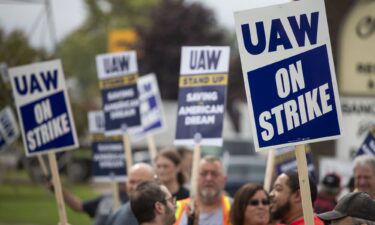 United Auto Workers members strike the General Motors Lansing Delta Assembly Plant on September 29