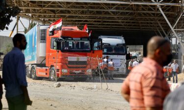 Trucks carrying aid arrive at the Palestinian side of the border with Egypt in Rafah in southern Gaza