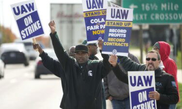 Members of the United Auto Workers union strike at a Stellantis plant in Michigan on October 23. The company has taken a $3.2 billion hit as a result of the walkouts.