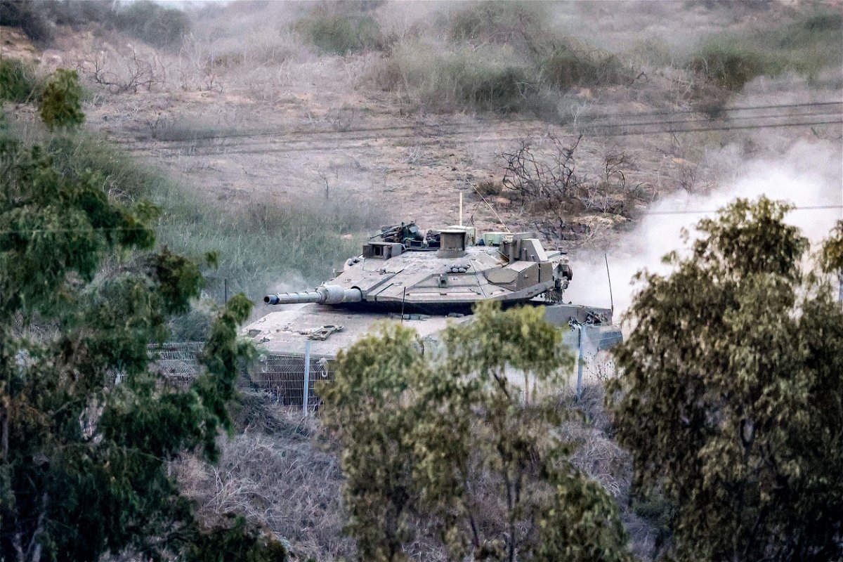 <i>Jack Guez/AFP/Getty Images</i><br/>An Israeli battle tank moves near a position along the border with the Gaza Strip in southern Israel on October 31