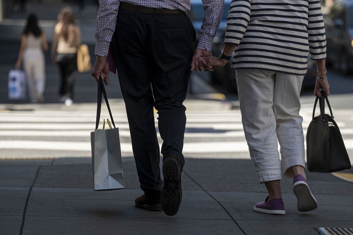 <i>David Paul Morris/Bloomberg/Getty Images</i><br/>A pedestrian carries a shopping bag in San Francisco