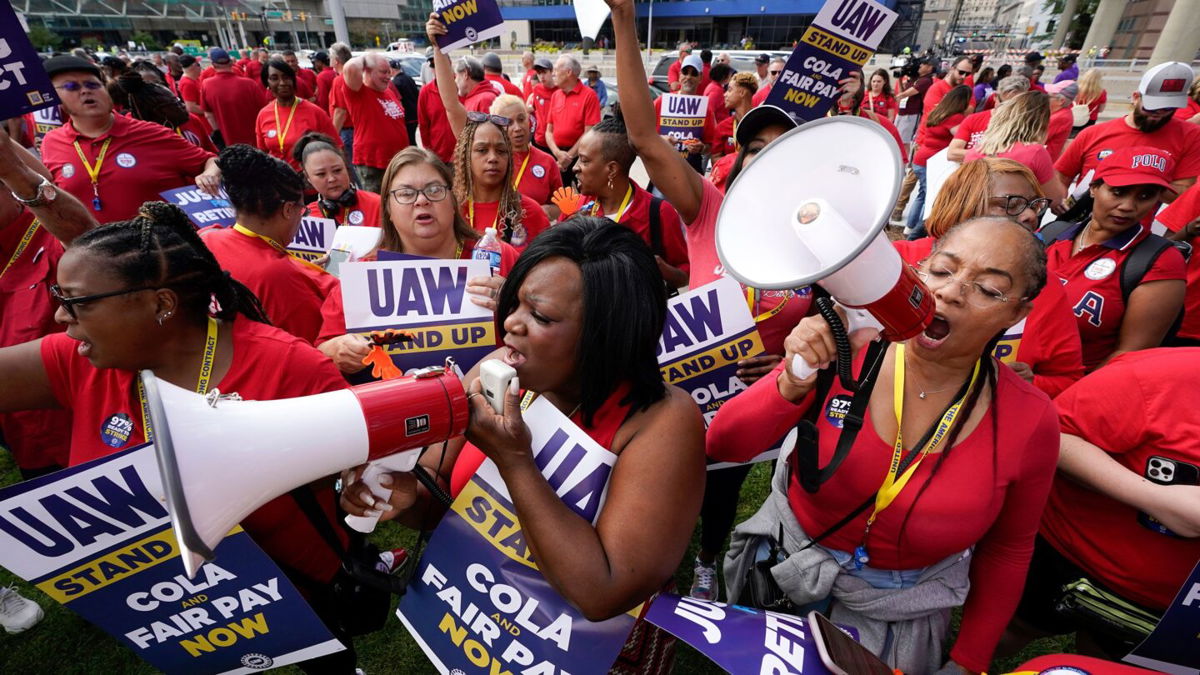 <i>Paul Sancya/AP</i><br/>United Auto Workers members attend a rally in Detroit on September 15. From actors to autoworkers