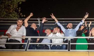 Populist SMER party leader and Slovakia's former Primer Minister Robert Fico (2nd L) celebrates his victory in the general elections alongside party members at the party's headquarters in Bratislava on October 1.