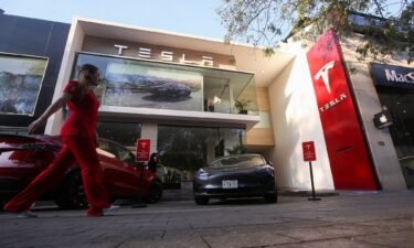Tesla reported slower third quarter sales that fell short of Wall Street forecasts. Pictured is a Tesla dealership in Mexico City