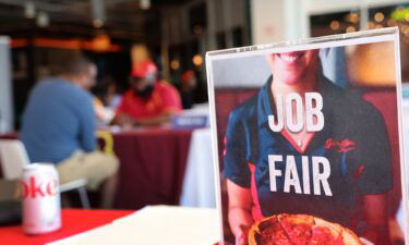 The US job market surged in September. Pictured are job seekers at a job fair at Navy Pier on April 11