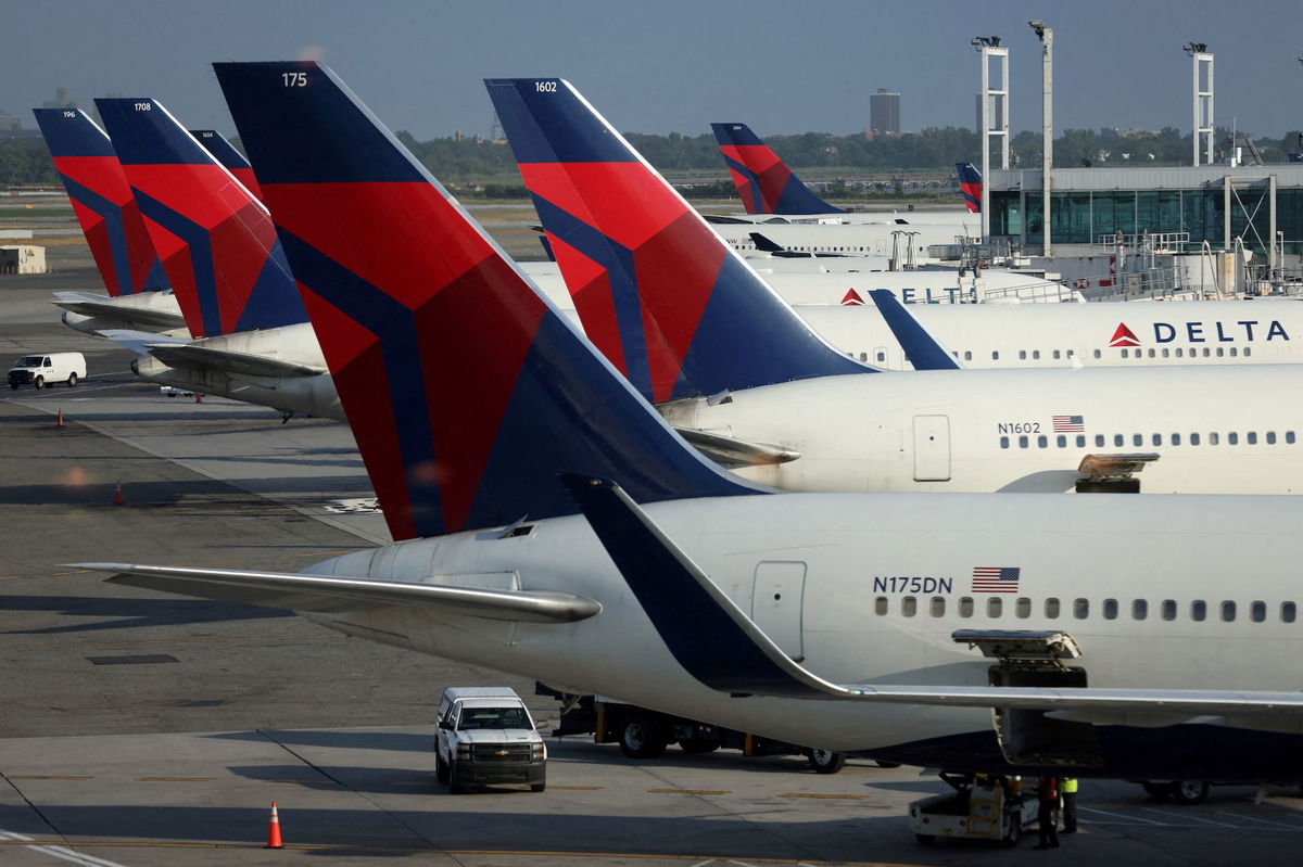 <i>Andrew Kelly/Reuters</i><br/>Delta Air Lines will pay tens of millions of dollars to settle a class-action lawsuit from customers who said the airline wouldn’t refund their canceled flights in the beginning of the Covid-19 pandemic.