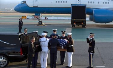 Members of an armed forces color guard carry the casket containing the body of Sen. Dianne Feinstein at San Francisco International Airport