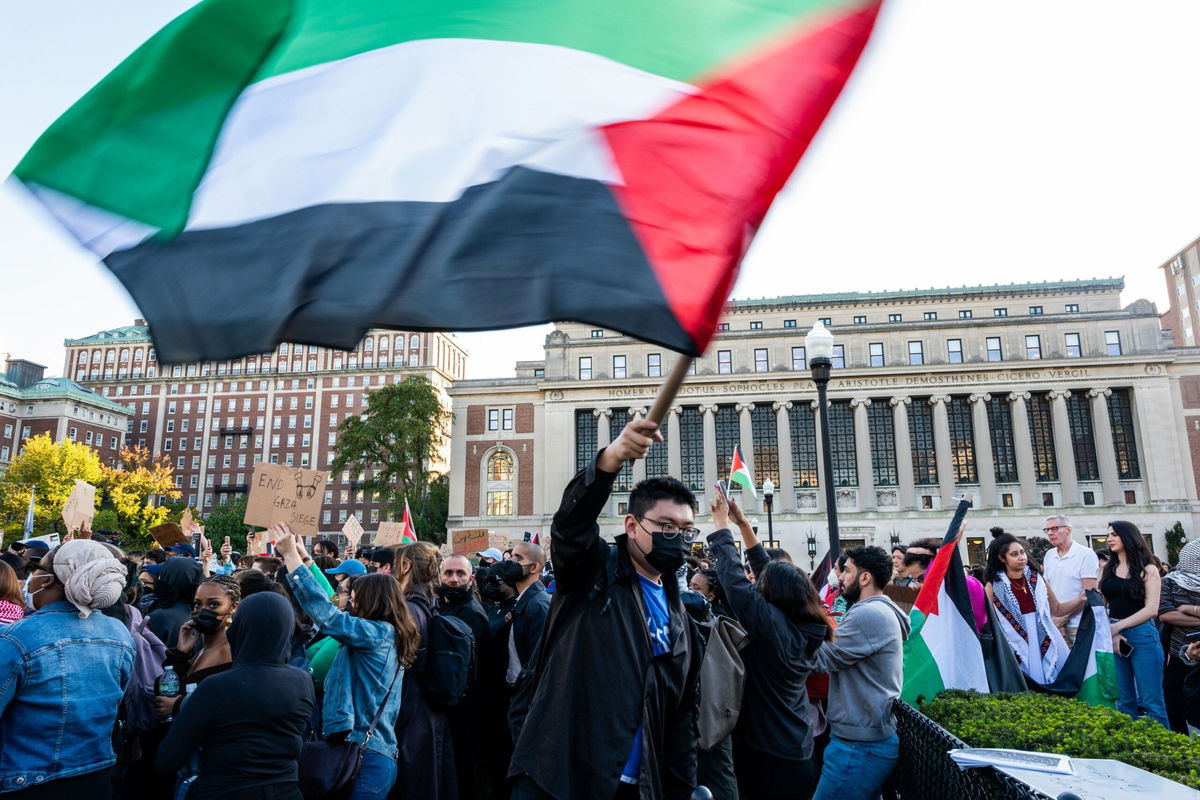 <i>Spencer Platt/Getty Images</i><br/>Columbia University students participate in a rally in support of Palestinians at the university on October 12 in New York City.