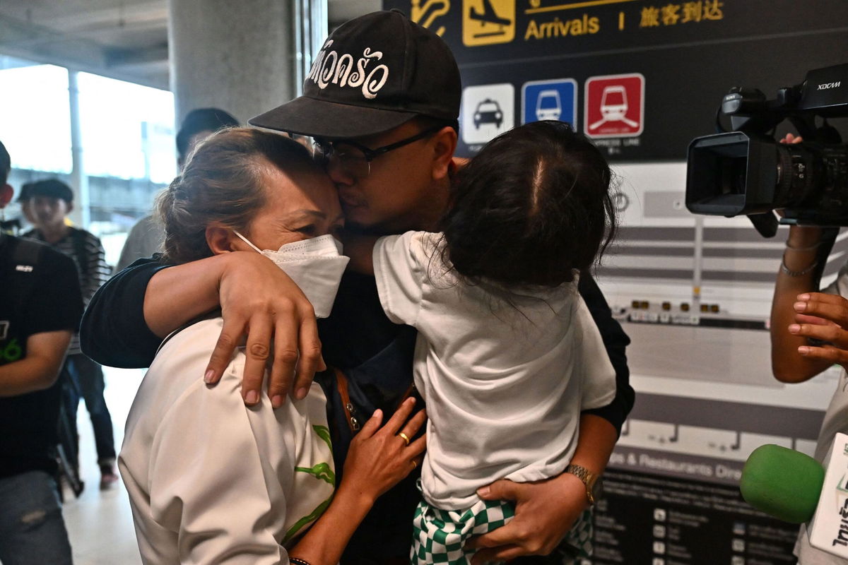 <i>Lauren DeCicca/Getty Images</i><br/>Thai migrant farm workers from Tel Aviv arriving at the airport in Bangkok on Thursday after a government evacuation.