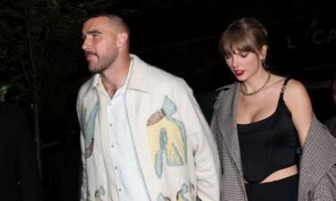 Travis Kelce and Taylor Swift hold hands in New York City on October 14.