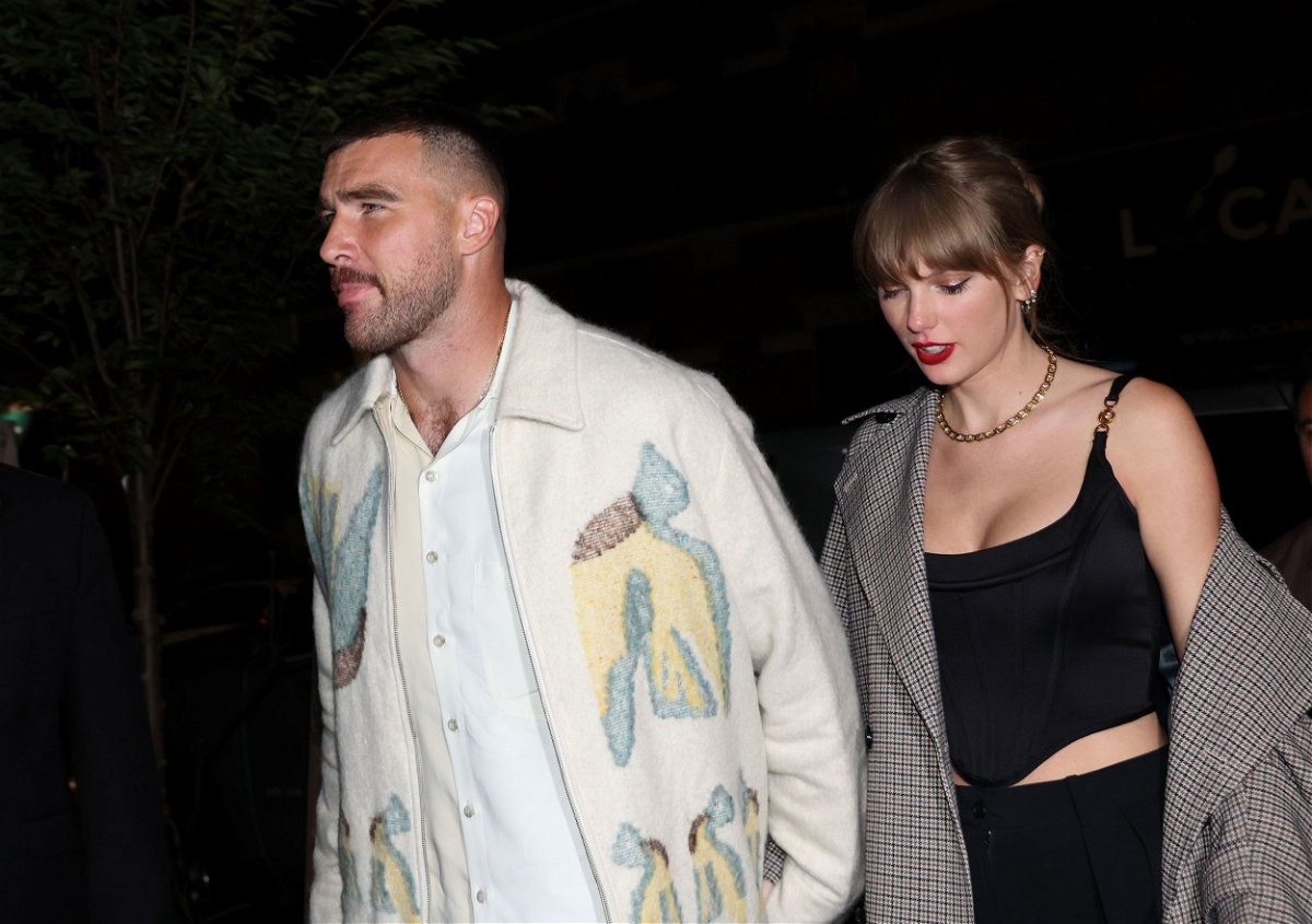 <i>Johnny Nunez/WireImage/Getty Images</i><br/>Travis Kelce and Taylor Swift hold hands in New York City on October 14.