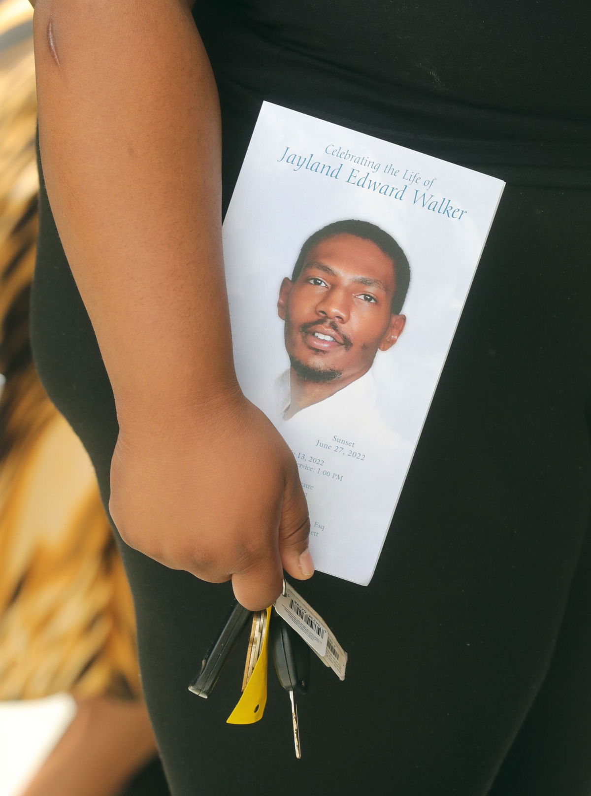 <i>Phil Masturzo/Akron Beacon Journal/USA Today Network</i><br/>A mourner is seen at the funeral of Jayland Walker in July 2022 in Akron