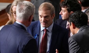 Rep. Jim Jordan talks with Rep. Kevin McCarthy and others at the Capitol in Washington on October 18.