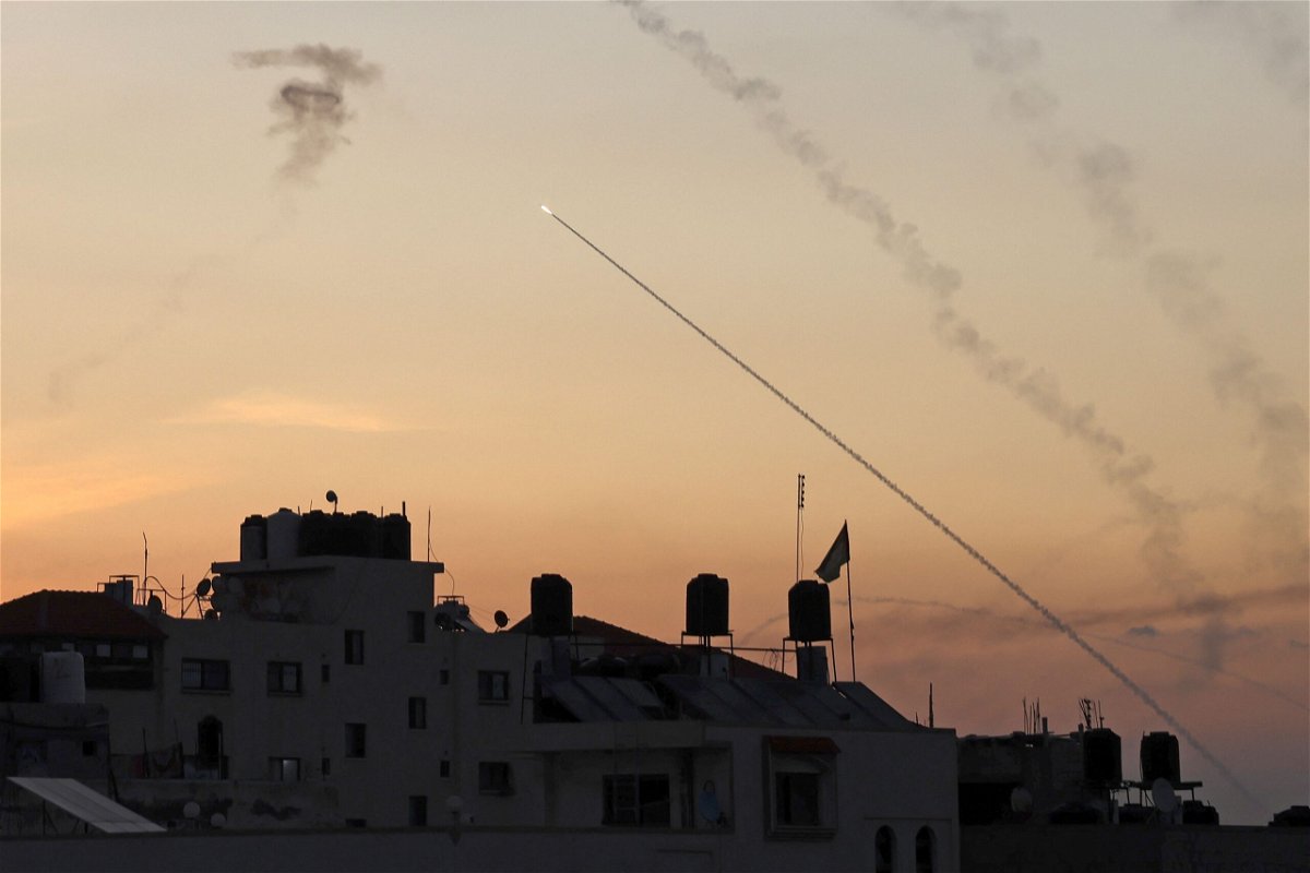 <i>Mohammed Abed/AFP/Getty Images</i><br/>Rockets are fired from Gaza City as Israel's Iron Dome air defence system attempts to intercept them on October 7.