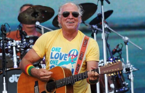 Musician Jimmy Buffett performs at a concert on the beach in 2010 in Gulf Shores