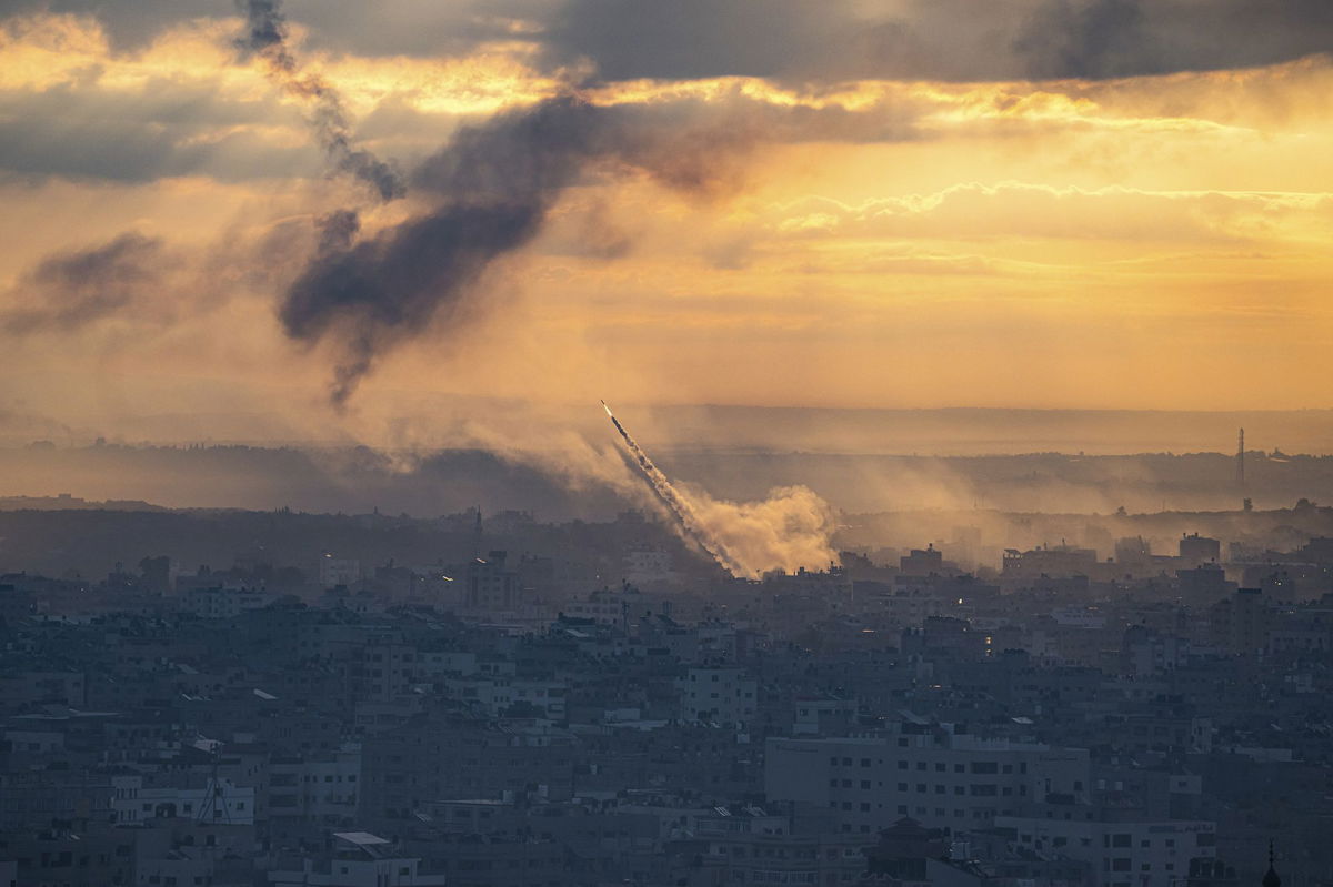 <i>Fatima Shbair/AP</i><br/>Rockets are fired toward Israel from the Gaza Strip on October 7. Hamas has been barred from most social media platforms.