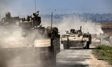 Israeli army Puma armored personnel carriers move in a column near the Gaza border in southern Israel on October 14. A new CNN poll shows that the American public expresses deep sympathy for the Israeli people.