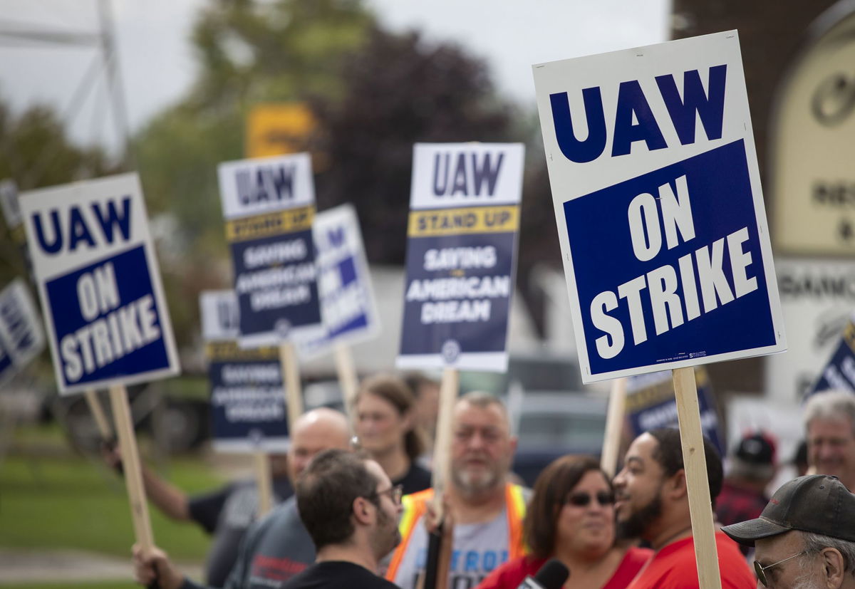 <i>Bill Pugliano/Getty Images</i><br/>United Auto Workers members strike the General Motors Lansing Delta Assembly Plant in Lansing