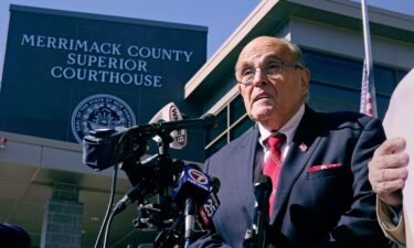 Former New York Mayor Rudy Giuliani addresses reporters in Concord