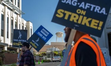 Workers walking in a SAG-AFTRA picket line at the Sony Pictures Studios on October 11 in Culver City