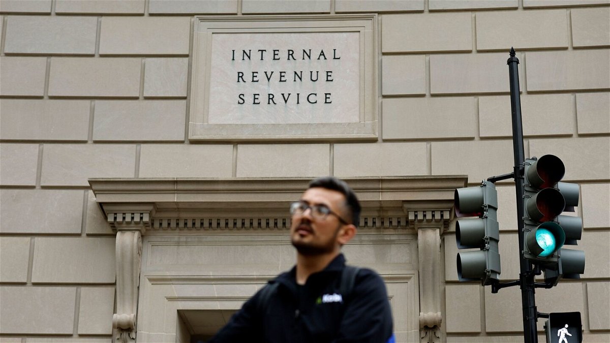 <i>Chip Somodevilla/Getty Images</i><br/>Tourists walk past the headquarters of the Internal Revenue Service near the National Mall on April 7 in Washington. The ex-IRS contractor accused of leaking former President Donald Trump’s tax returns disclosed so many people’s tax information that prosecutors want to notify the thousands of victims through a public website