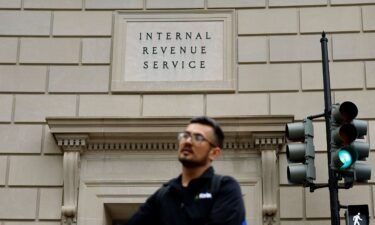 Tourists walk past the headquarters of the Internal Revenue Service near the National Mall on April 7 in Washington. The ex-IRS contractor accused of leaking former President Donald Trump’s tax returns disclosed so many people’s tax information that prosecutors want to notify the thousands of victims through a public website