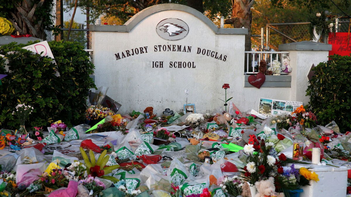 <i>Rhona Wise/AFP via Getty Images</i><br/>A makeshift memorial at Marjory Stoneman Douglas High School in Parkland