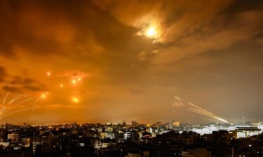 Rockets fired by Palestinian militants from Gaza City are intercepted by the Israeli Iron Dome defense missile system in the early hours of October 8.