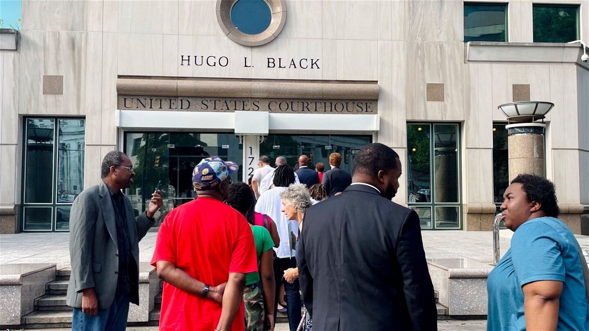 <i>Kim Chandler/AP</i><br/>A line of people wait outside the federal courthouse in Birmingham
