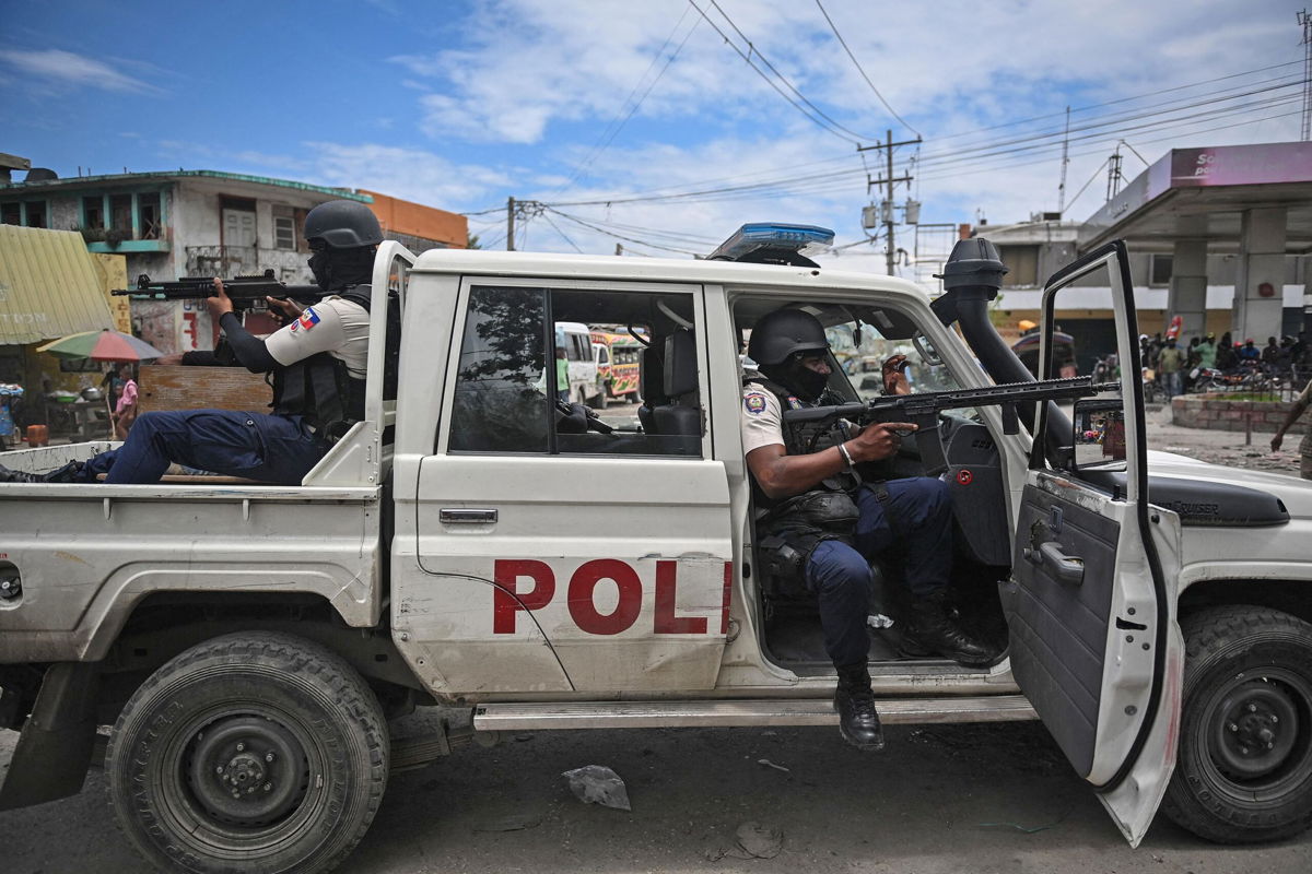 <i>Richard Pierrin/AFP/Getty Images</i><br/>Police officers patrol a Haiti neighborhood amid gang-related violence in downtown Port-au-Prince on April 25