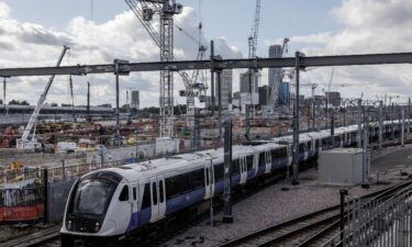 A train travels past construction on a HS2 site in London on October 3.