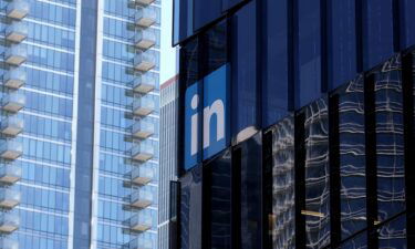A sign is posted on the exterior of a LinkedIn office on July 26 in San Francisco