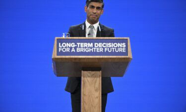 Britain's Prime Minister Rishi Sunak addresses delegates at the annual Conservative Party Conference in Manchester