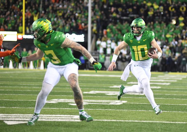 Oregon quarterback Bo Nix (10) runs for a touchdown during the first half of an NCAA college football game against Oregon State, Friday night at Eugene's Autzen Stadium