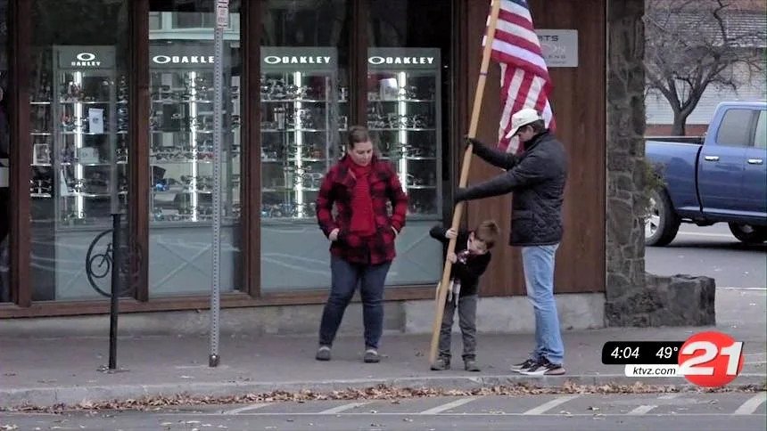 Downtown Bend US flag installation is sometimes a family affair