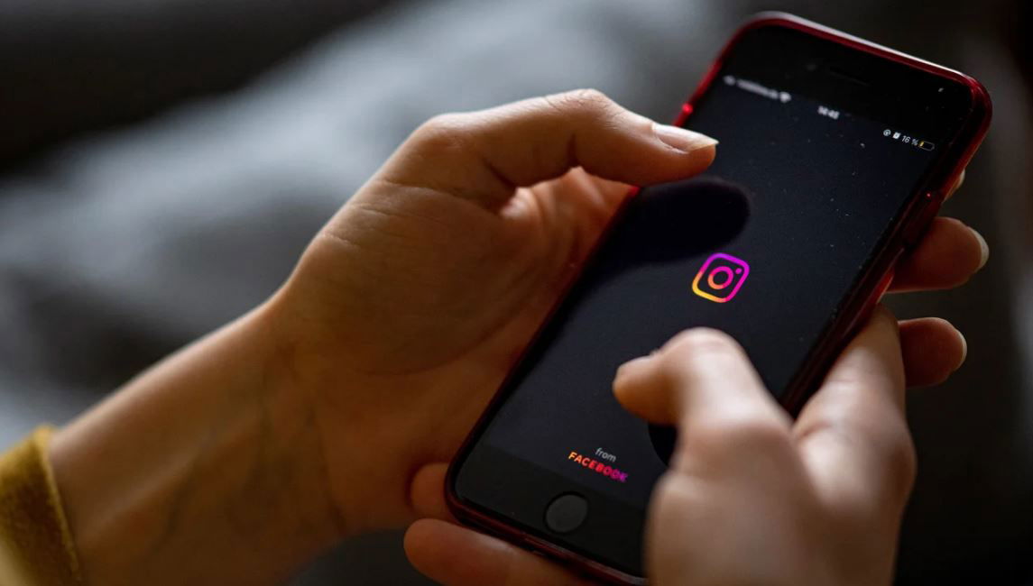 <i>Fabian Sommer/picture alliance/dpa/Getty Images</i><br/>The logo of the Instagram app is seen on the screen of a smartphone in 2021.