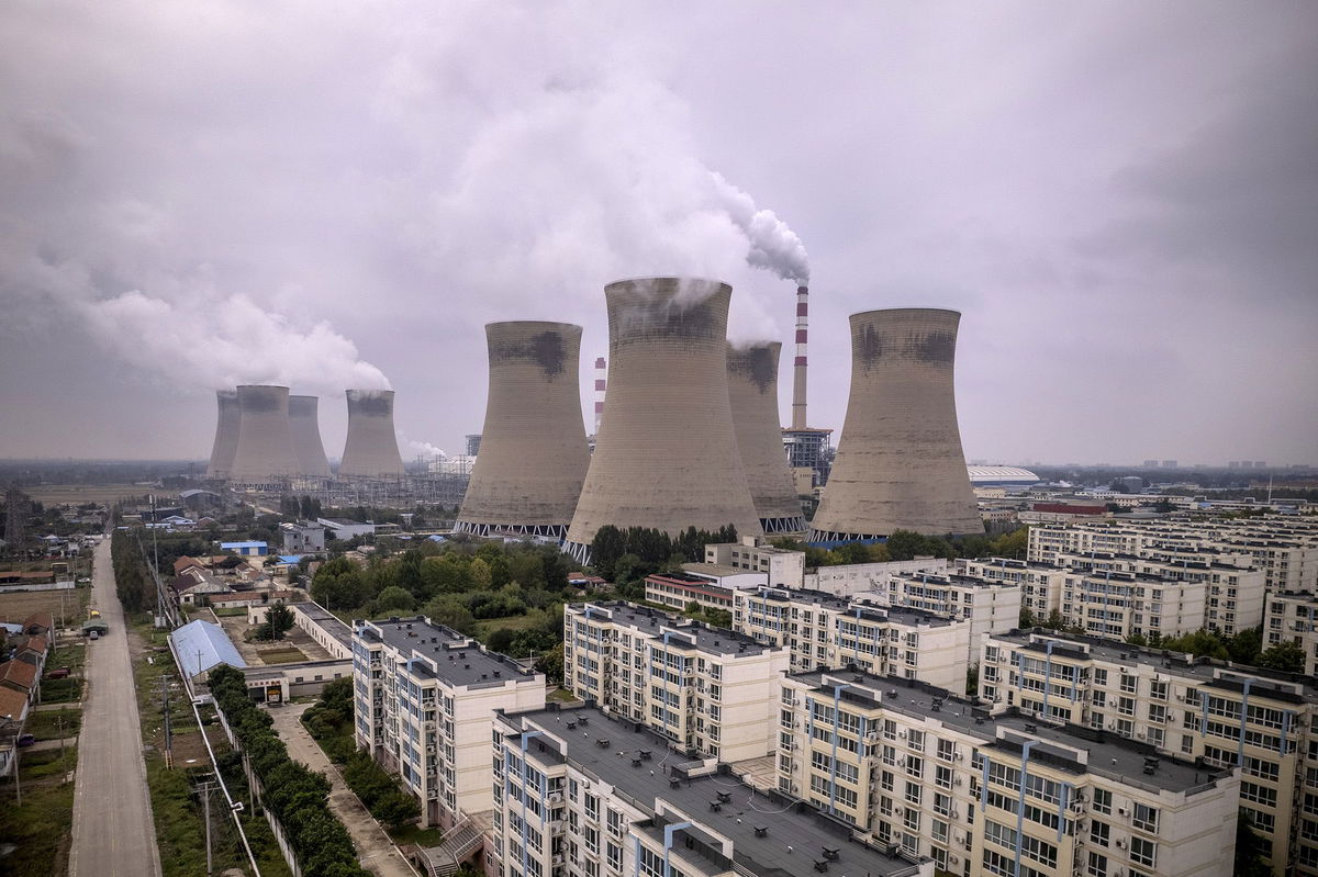 <i>Joe Sohm/Visions of America/Universal Images Group Editorial/Getty Images</i><br/>Smoke stacks and cooling towers at the Jon Amos coal-fired power plant in West Virginia.