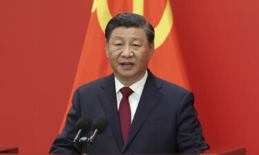 Chinese leader Xi Jinping greets foreign journalists at the Great Hall of the People in Beijing on October 23