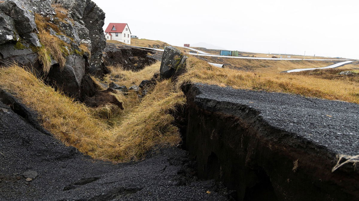 <i>Ragnar Visage/RUV/Reuters</i><br/>Cracks caused by volcanic activity emerge on a road in Grindavík