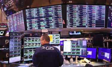 Traders work on the floor of the New York Stock exchange during morning trading on November 10