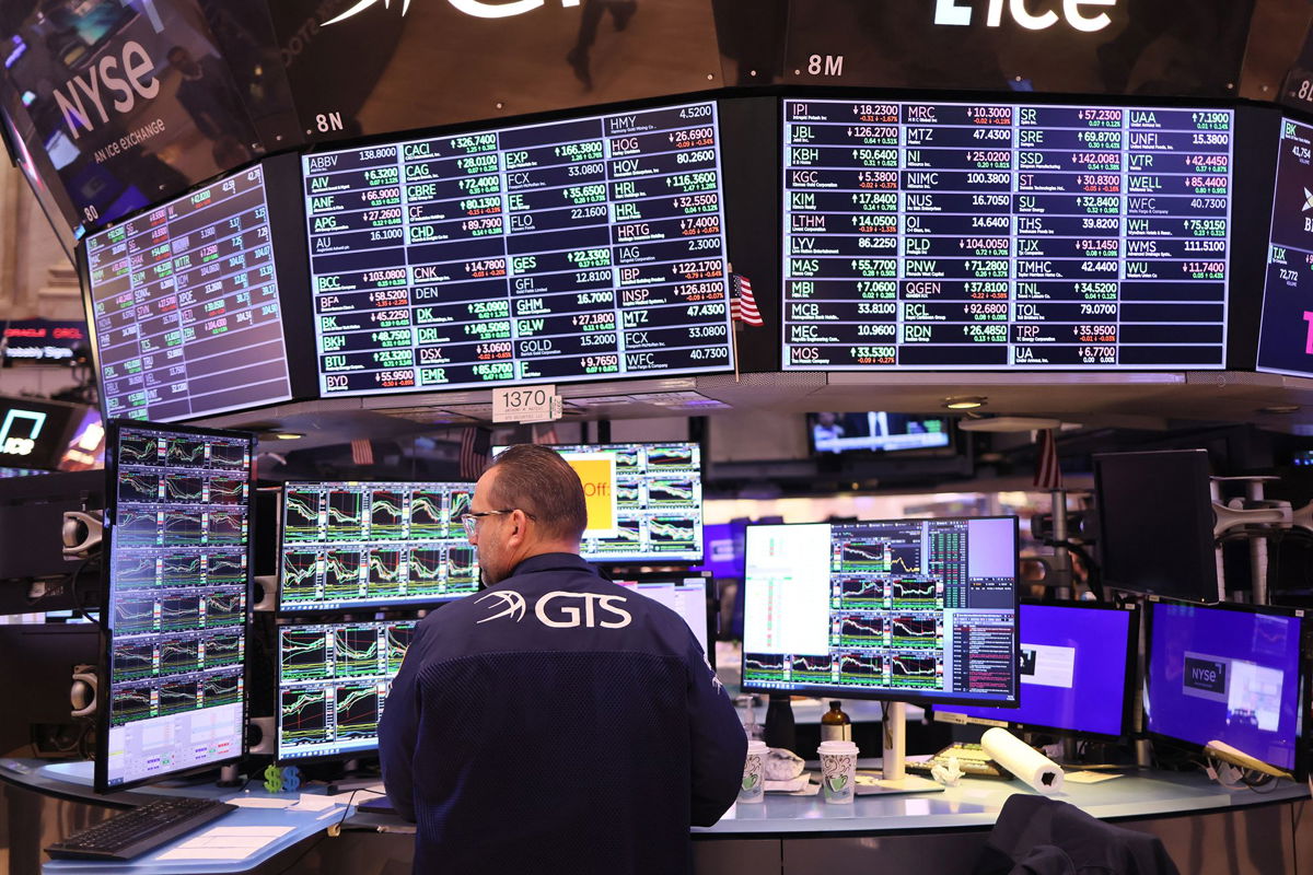 <i>Michael M. Santiago/Getty Images</i><br/>Traders work on the floor of the New York Stock exchange during morning trading on November 10