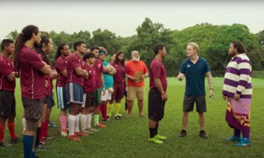 Michael Fassbender (second from right) takes over a struggling soccer team in "Next Goal Wins."