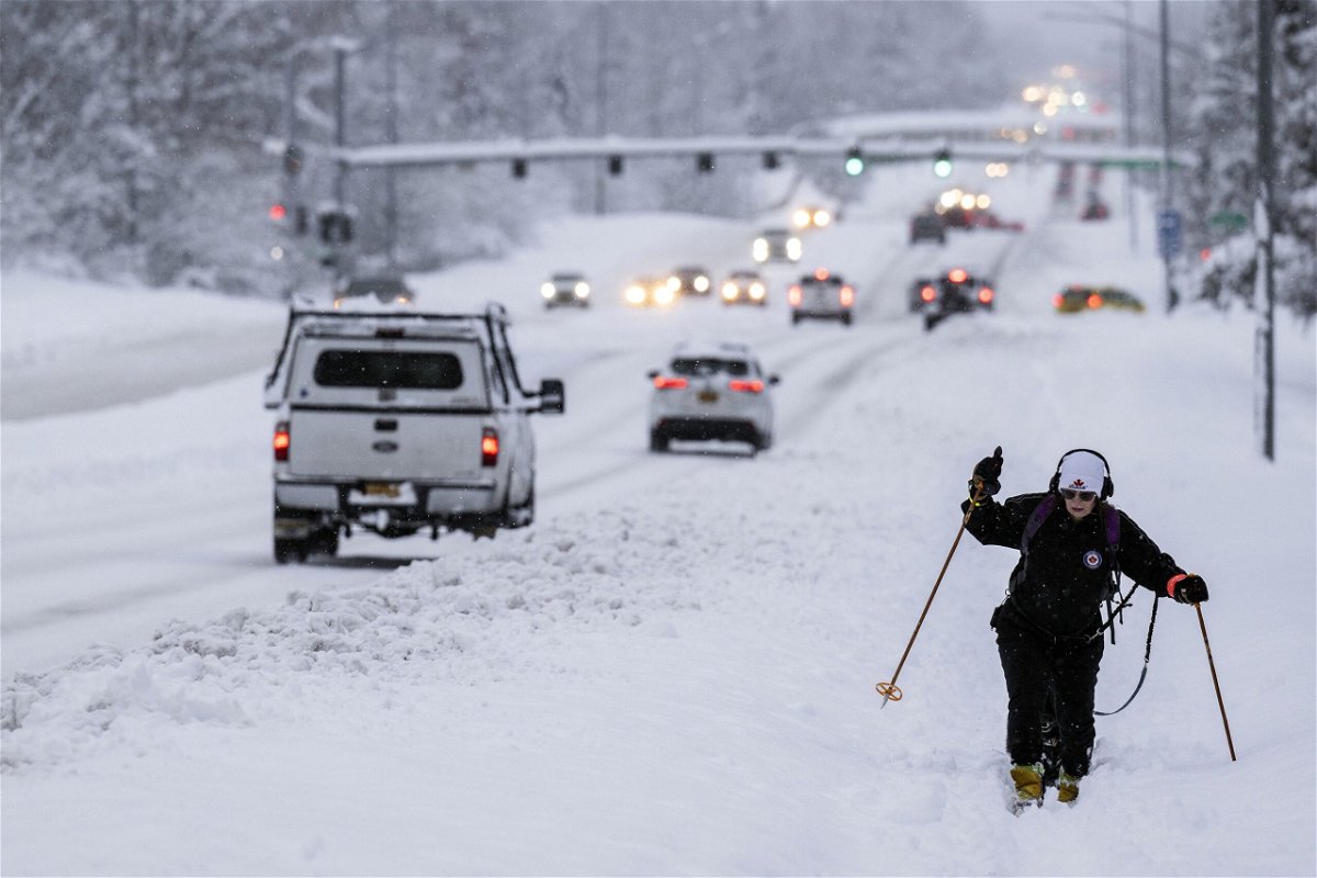 <i>Marc Lester/Anchorage Daily News/AP</i><br/>Jodie Gallamore cross-country skis along Tudor Road after a heavy snowfall in Anchorage on Thursday