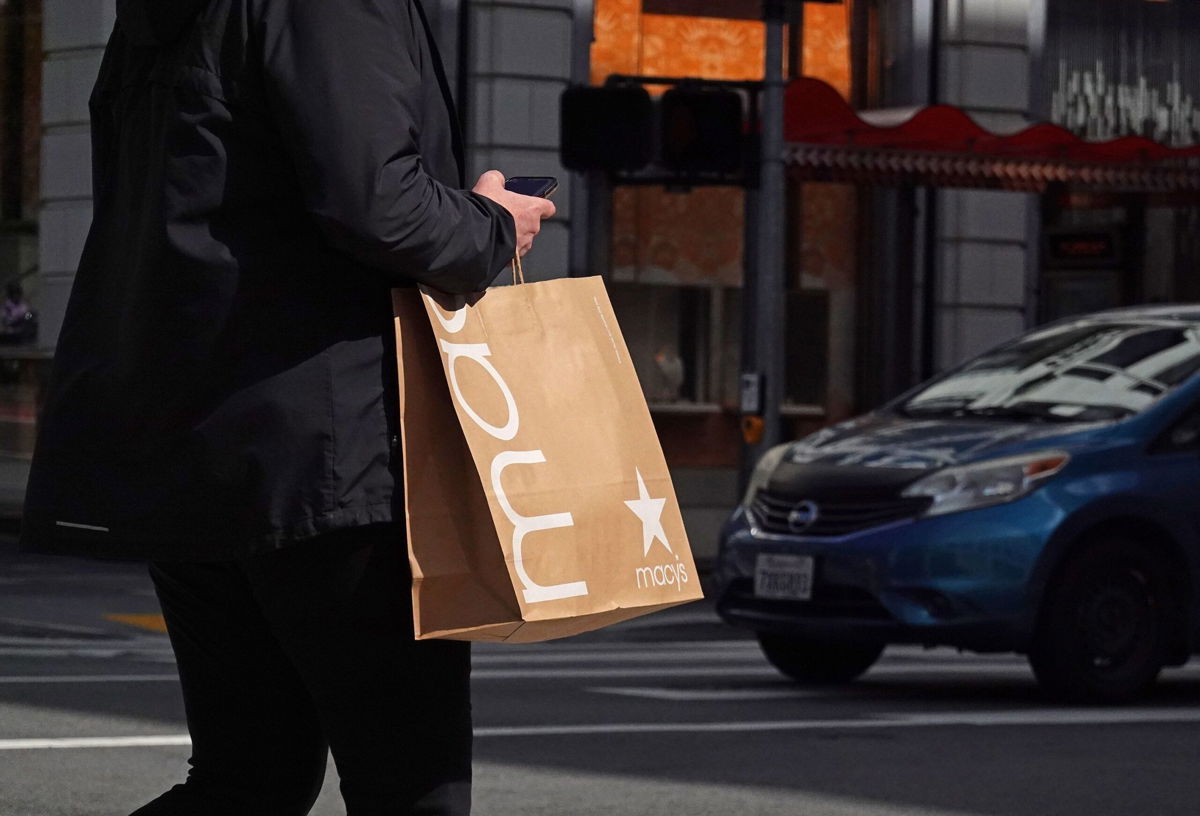 <i>Justin Sullivan/Getty Images</i><br/>A pedestrian carries a shopping bag while walking through the Union Square shopping district on October 2