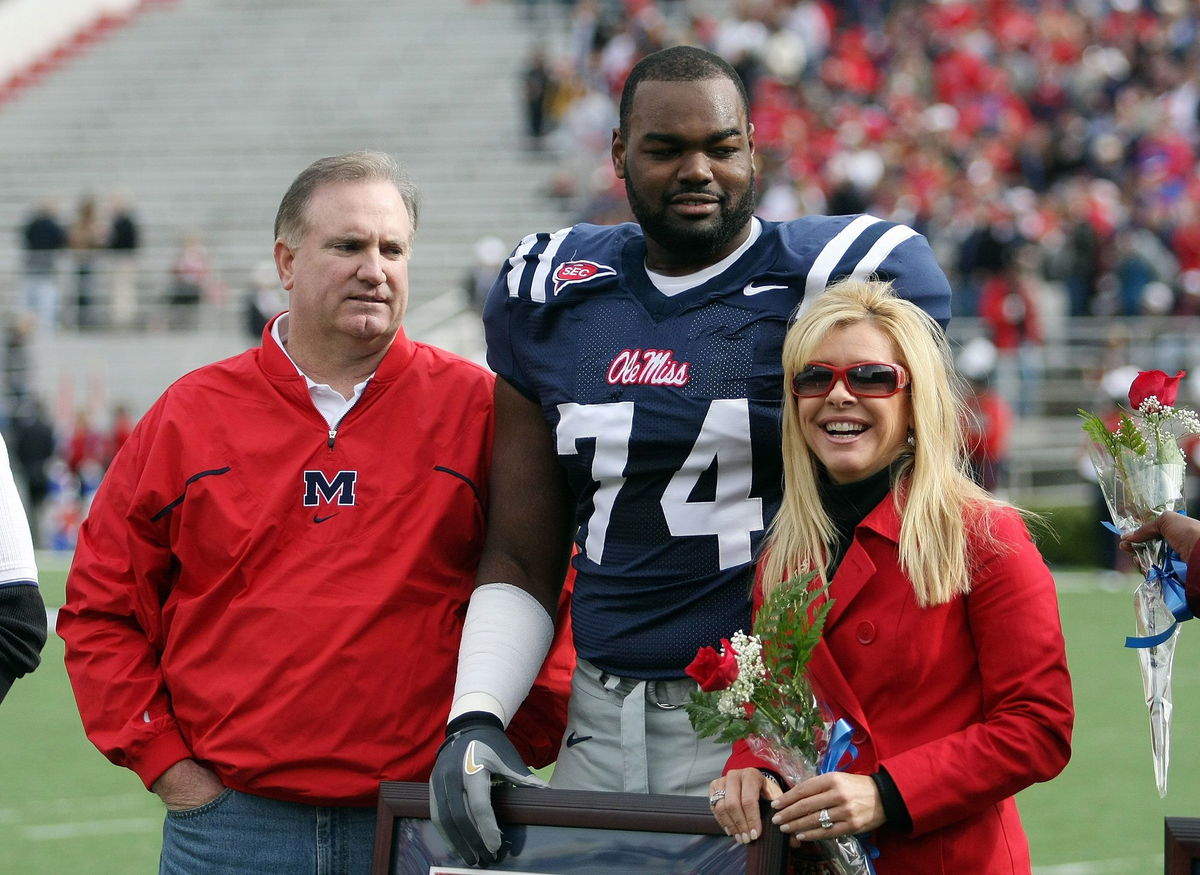 <i>Nick Wass/AP</i><br/>Michael Oher  sits on the beach during an NFL game between the Baltimore Ravens and the Buffalo Bills in 2010.