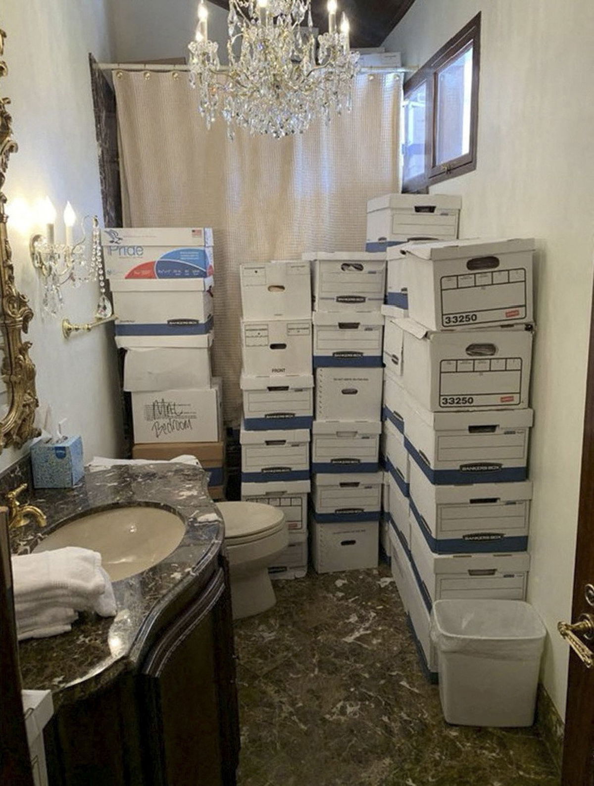 <i>U.S. Justice Department/Handout/Reuters</i><br/>A photo published by the U.S. Justice Department in their charging document against former President Donald Trump shows boxes of documents stored in a bathroom at Trump's Mar-a-Lago club in Florida in early 2021.